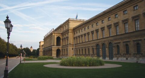 Hercules Hall surrounded by greenery under the sunlight at daytime in Munich in Germany